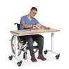 Am Therapietisch Fiete sitzt Patient im Rollstuhl und übt am WorkPark Therapiegerät Steckbrett magnetisch seine Fingerfertigkeit